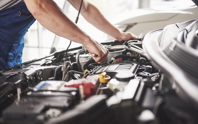 Mechanic servicing a car